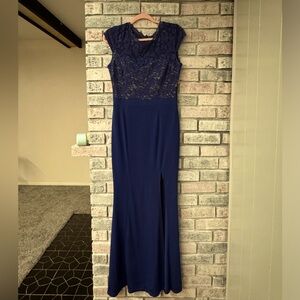 Royal blue Rephyllis dress. size medium. Has a slit in the right leg.